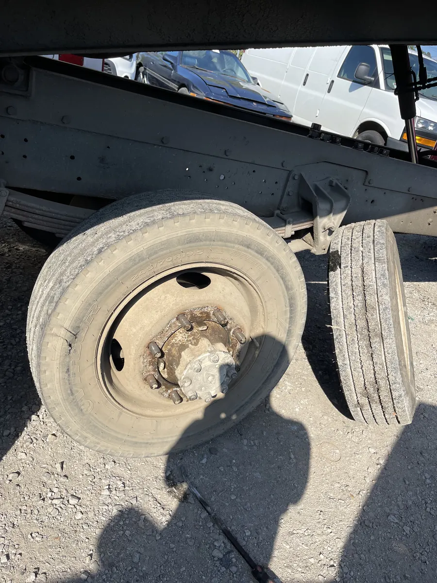 Semi truck wheel pulled off the axle for tire service